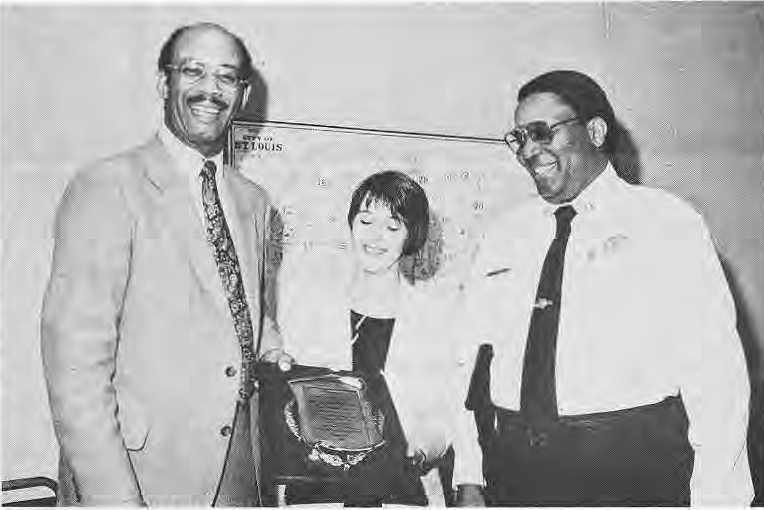 Capt. Charles Alphin, Nancy Farmer and Capt. Everett Page at reception.