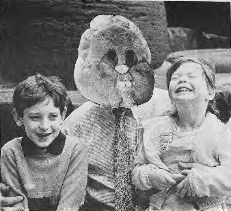 Original printed joke photograph accompanying the Tom Hoerr correction, showing a large elephant head or mask between two students.