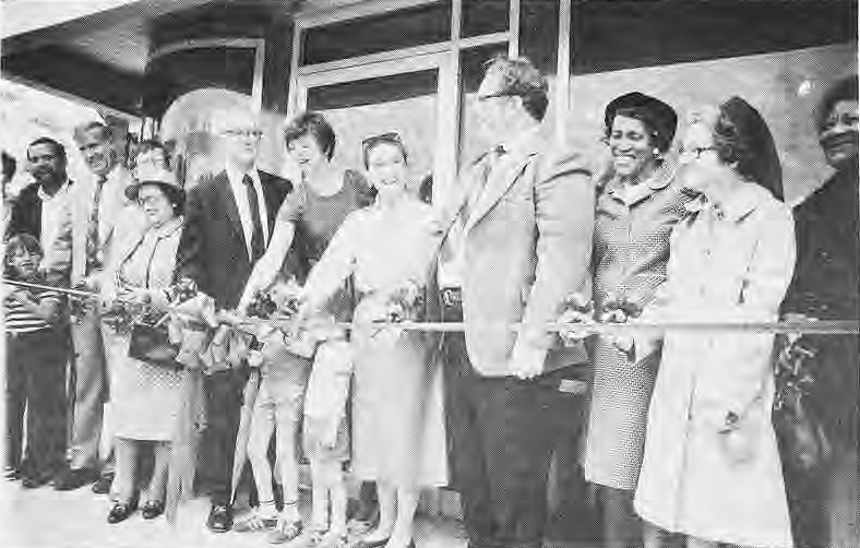 Neighbors and officials cutting the ribbon at the Kiosk’s 1983 opening.