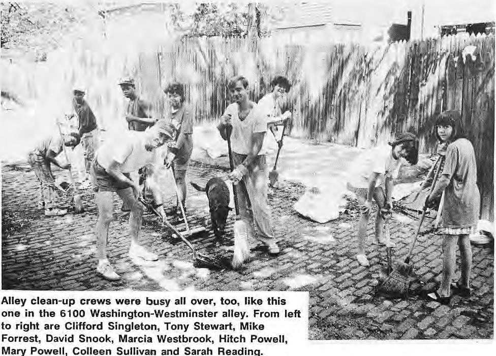 Alley clean-up crews were busy all over, too, like this one in the 6100 Washington-Westminster alley. From left to right are Clifford Singleton, Tony Stewart, Mike Forrest, David Snook, Marcia Westbrook, Hitch Powell, Mary Powell, Colleen Sullivan and Sarah Reading.