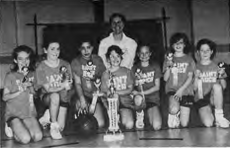 St. Roch fourth-grade girls team and coach Maggie Hart-Mahon.Photo by Joe Edwards.