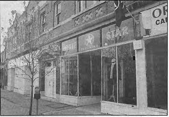 Storefront signs meeting the sign regulations. Photographer not credited.