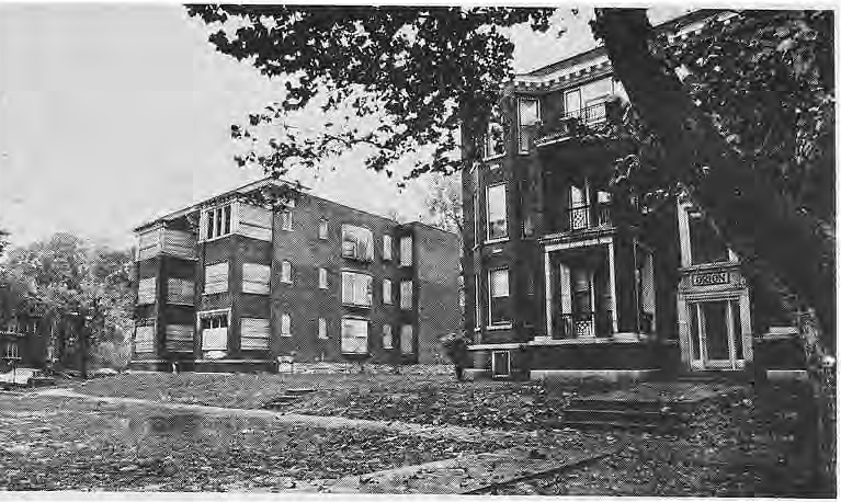 Vacant buildings and open land in Nina Place, first original photograph.
