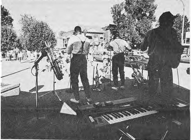 The Bosman Twins (center) entertained neighbors at Four Corners during Art Exposed with their special brand of jazz.