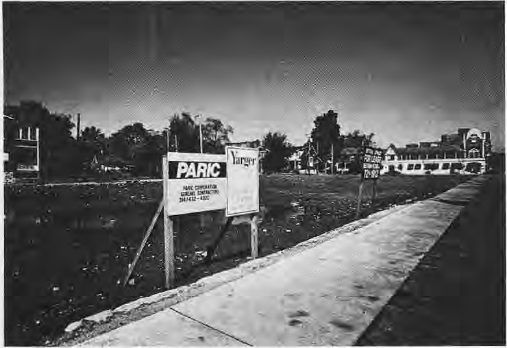 Vacant DeBaliviere construction site with a Paris restaurant sign.