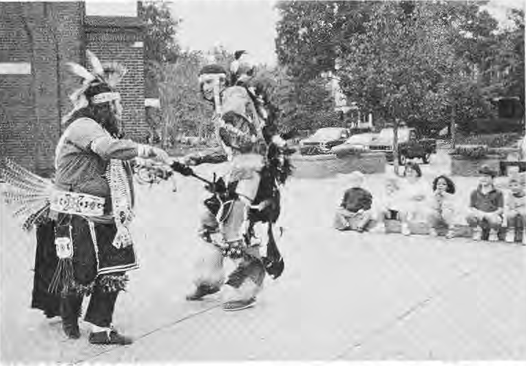 Joe and John Moore perform traditional dances by the Kiosk.
