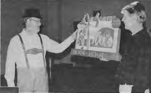 Bill Christman presents Art Santen with specially created artwork. Photo by King Schoenfeld.