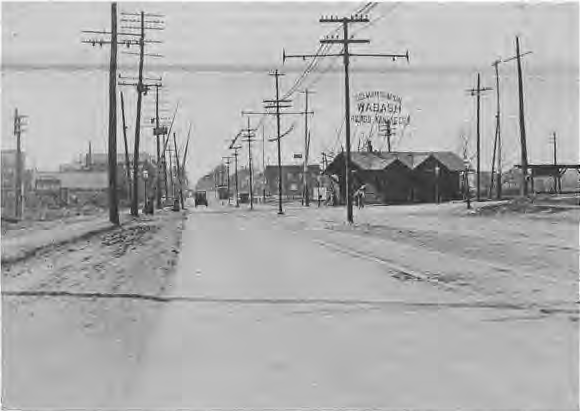 The Wabash Crossing at Delmar, looking west in 1923, shortly before the railroad was dropped below grade and the Des Peres River enclosed. Courtesy Missouri Historical Society.