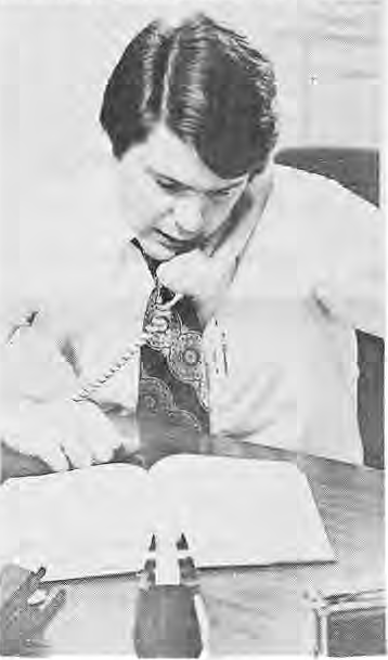 Original photograph of Vincent C. Schoemehl, Jr. writing at a desk.