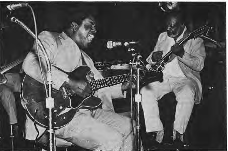 Two blues guitarists pictured with the concert article.
