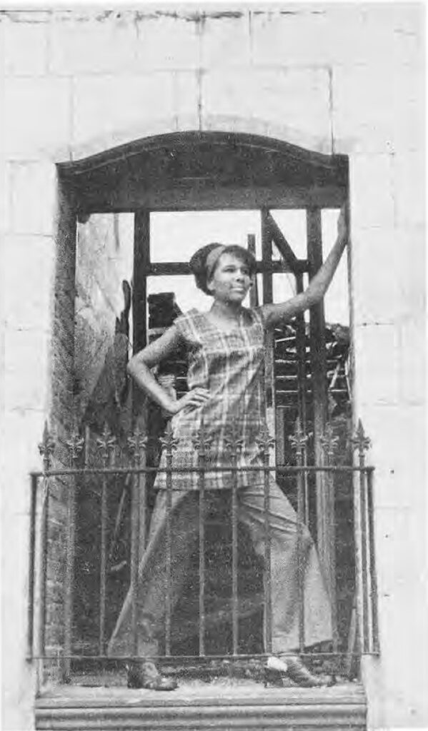 Mary Coleman models a slack and tunic outfit made by the young women for sale in The Boutique Shop, recently opened at 323 DeBaliviere.