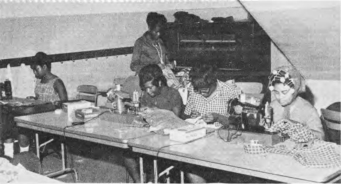 Production line for The Boutique Shop in operation. These are some of the girls who sew regularly in St. Roch’s Church basement and market their work at newly opened shop on DeBaliviere.