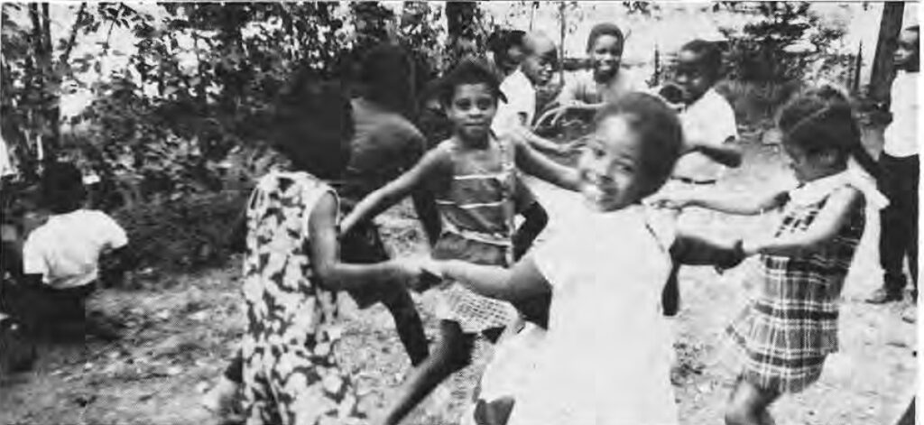 Children playing outdoors in the Something for Summer program