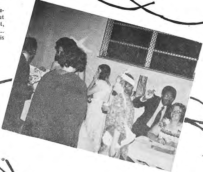 Guests standing and sitting together at the neighborhood prom.
