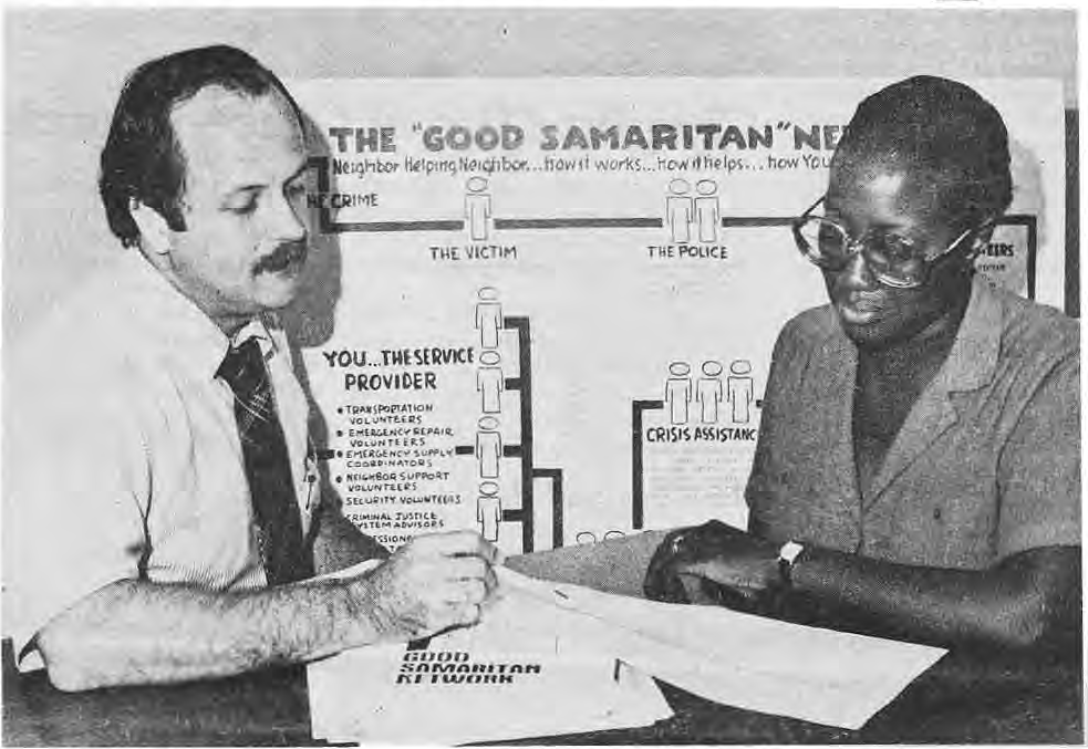 Original photograph of Ed Stout and Patricia Gladney reviewing the network plan.