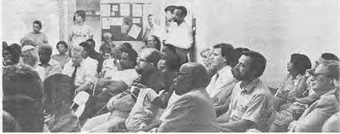 Residents listening and speaking at a neighborhood meeting.
