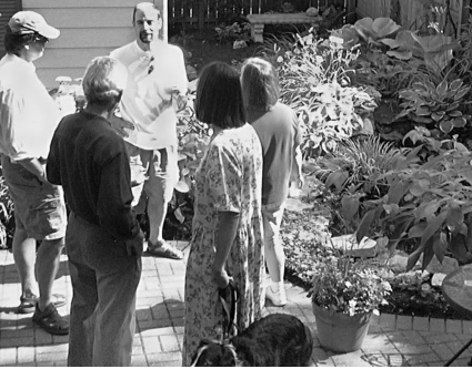 Elsie Listrom and Dave Wood fish pond attracts Westminster neighbor Hitch Powell and others.
