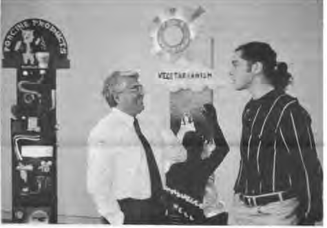 YAHOO participant Sam DiLorenzo (right) talks with Juan Chavez, father of two YAHOO students. Photographer not credited.