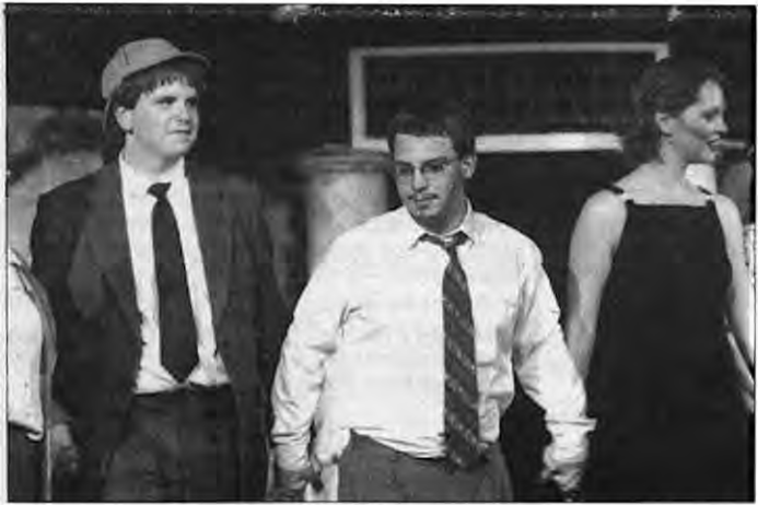 Jeff Schoenfeld, center with white shirt, takes a bow with Metro High School cast in April. Photographer not credited.