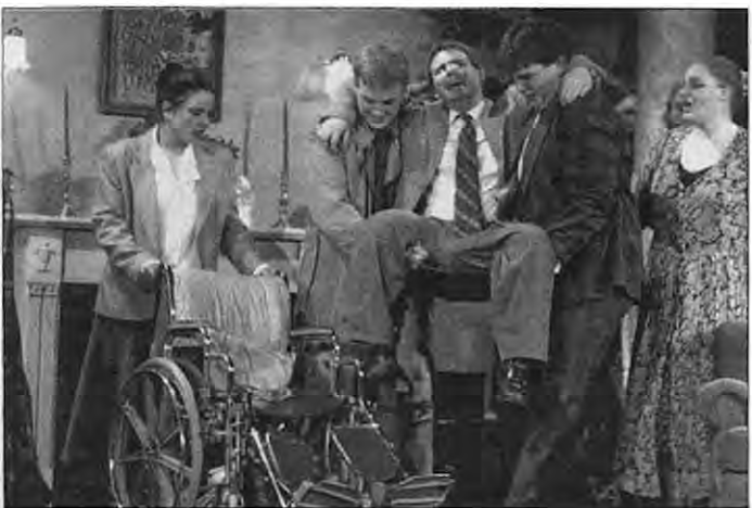 Jeff Schoenfeld, center being carried, plays Sheridan Whiteside in The Man Who Came to Dinner at Metro High School. Photographer not credited.