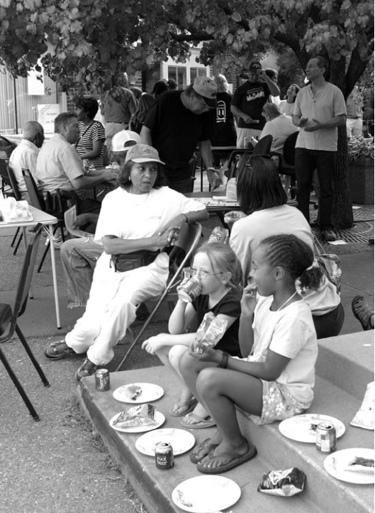 National Night Out will be held August 7 at Greg Freeman Park at Four Corners; original image illustrates earlier gathering. Photographer not credited.