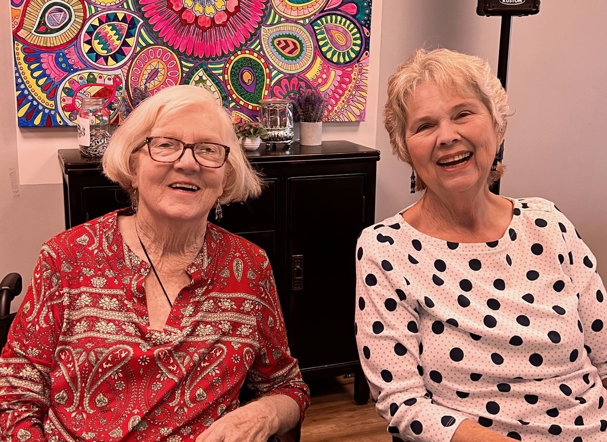 Neighborhood besties Jo Ann Vatcha and Lu Green enjoy one of many laughs.