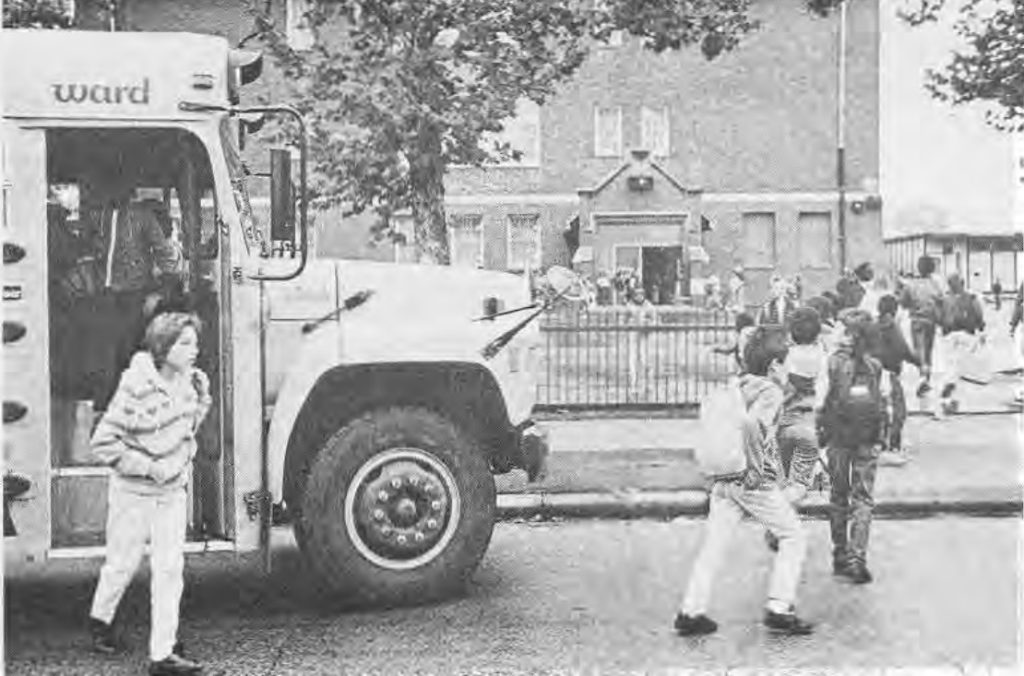 Children arriving by school bus at Hamilton Elementary School in November 1988.