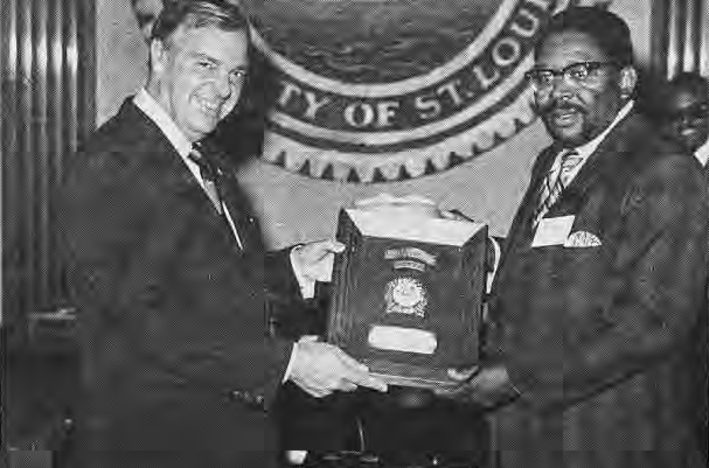 The mayor presenting Jack Wright with the Beautification Award, as identified by the printed caption.