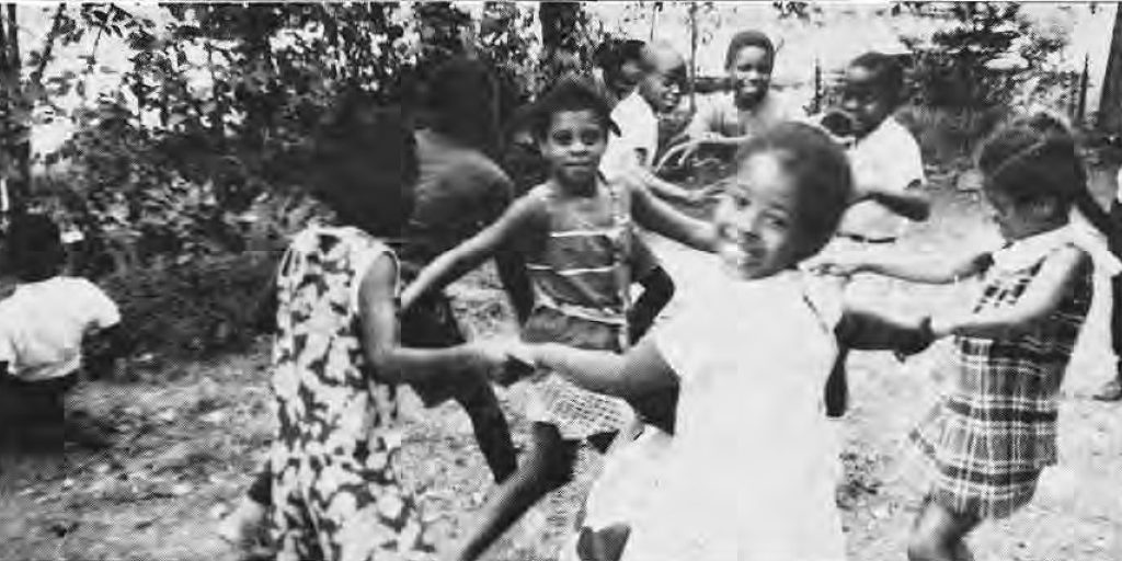 Children playing outdoors in the Something for Summer program