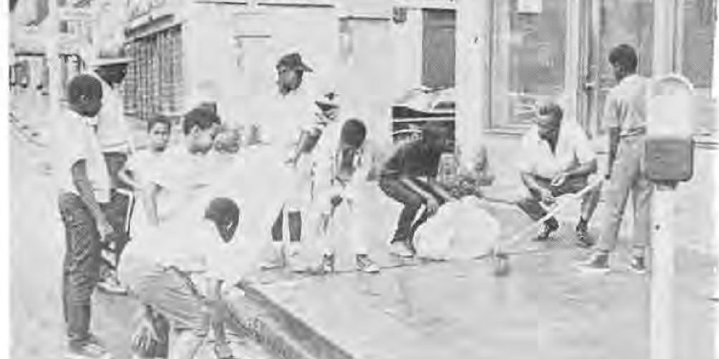 Neighborhood boys cleaning sidewalks during Operation Little Sweep