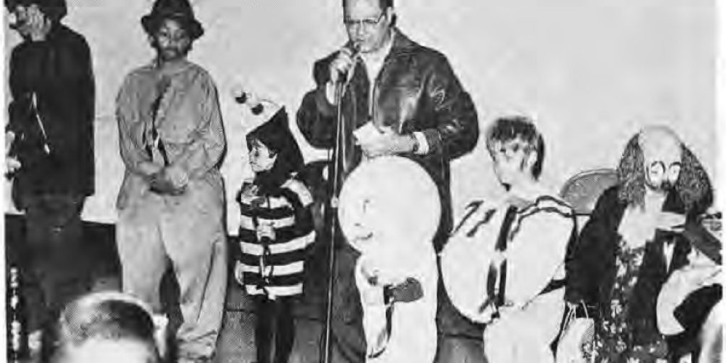 Costumed children accepting prizes at the Rosedale-Skinker Halloween party