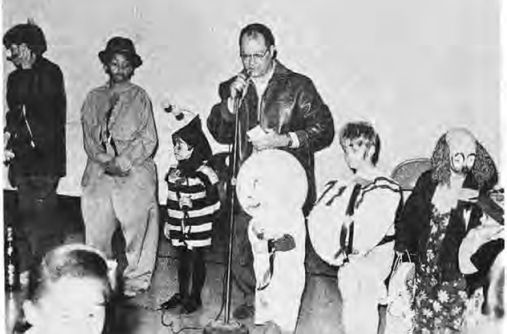 Costumed children accepting prizes at the Rosedale-Skinker Halloween party